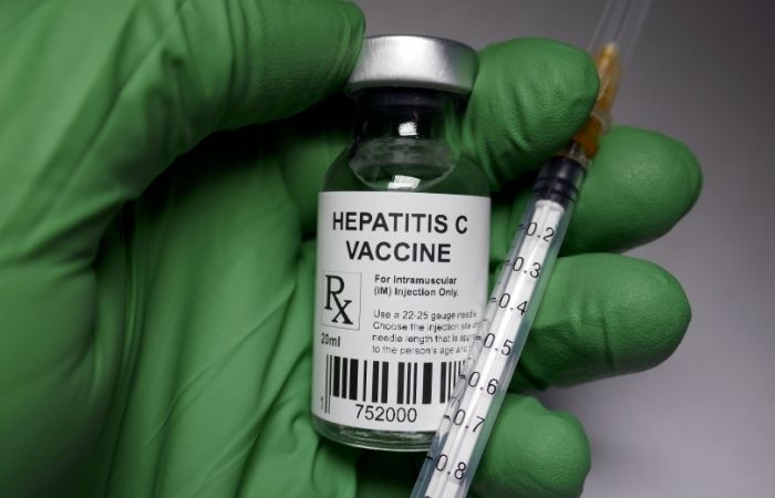 Hepatitis C rapid antibody test concept with fingerstick blood sample and result strip showing a result in about fifteen minutes